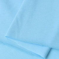 Close-up of Longan Craft’s Cotton Jersey Fabric By The Yard—light blue, soft, breathable single jersey material with a fine knit pattern—ideal for casual wear and crafts.