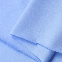 Close-up of Longan Craft Cotton Jersey Fabric By The Yard, in light blue. This colorful single jersey material is soft, lightweight, breathable, and ideal for making casual wear or other textile projects.