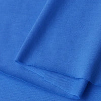 A close-up of Longan Craft's Cotton Jersey Fabric By The Yard reveals its smooth texture and fine weave. This soft, lightweight, and breathable solid blue single jersey material is perfect for making casual wear.