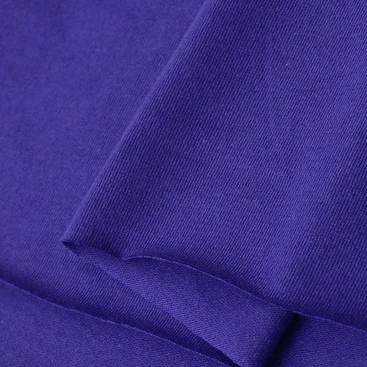 Close-up of Longan Craft's Cotton Jersey Fabric By The Yard—smooth, soft, and breathable single jersey material, ideal for making casual wear in vibrant purple.