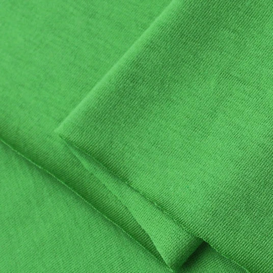 Close-up of Longan Craft’s Cotton Jersey Fabric By The Yard, a colorful single jersey material. This lightweight, breathable 100% cotton fabric is soft, flexible, and neatly folded to highlight its smooth texture and clean edges—perfect for casual wear.