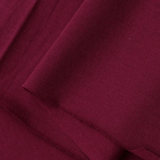 A close-up of Longan Craft Cotton Jersey Fabric By The Yard shows its fine, soft texture and subtle ribbing—ideal colorful single jersey material for casual wear.