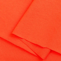Close-up of Longan Craft’s Cotton Jersey Fabric By The Yard—a vibrant orange, lightweight, breathable single jersey. This soft fabric is neatly layered, showing smooth clean edges—ideal for making casual wear.