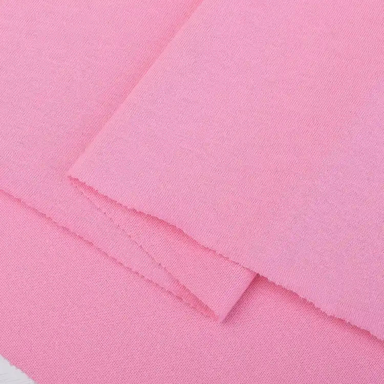 Two pieces of Longan Craft Cotton Jersey Fabric By The Yard, a soft and breathable colorful single jersey material ideal for casual wear, are stacked with one piece slightly overlapping the other. The fabric appears smooth and neatly cut.