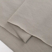 Two pieces of Longan Craft Cotton Jersey Fabric by the yard, colorful single jersey material made from soft 100% cotton ideal for casual wear, are layered together and displayed against a white background.