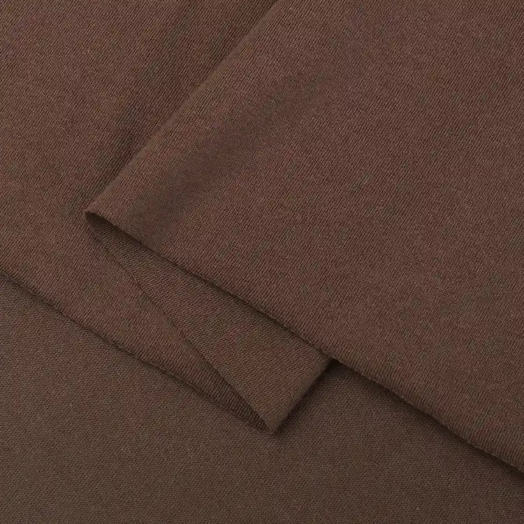 A close-up of Longan Craft’s Cotton Jersey Fabric By The Yard showcases its smooth, slightly textured surface and clean edges—perfect for breathable, soft casual wear with colorful single jersey material.