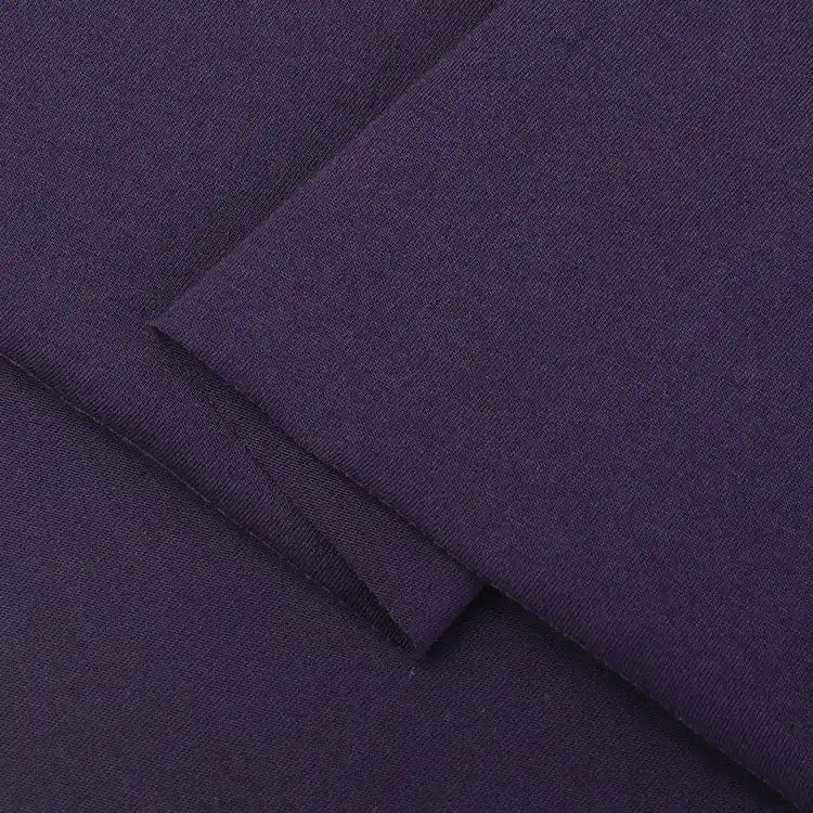 Close-up of Longan Craft’s dark purple Cotton Jersey Fabric By The Yard, neatly folded to show its smooth, slightly textured surface—perfect soft single jersey material for making colorful casual wear.