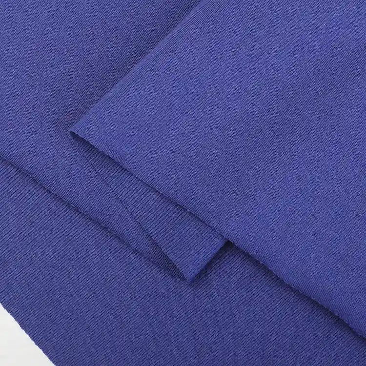 Close-up of soft, smooth royal blue Cotton Jersey Fabric by the yard from Longan Craft, layered to display texture and weave—ideal single jersey material for making casual wear.