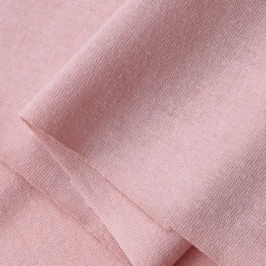 Close-up view of Longan Craft's Cotton Jersey Fabric By The Yard—colorful single jersey material made from 100% cotton, featuring a soft texture and neatly folded layers, ideal for making casual wear.