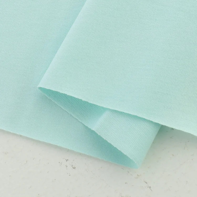 A close-up of Longan Craft Cotton Jersey Fabric By The Yard in light blue, neatly folded to display its smooth, soft, and breathable single jersey texture—ideal for making comfortable casual wear.