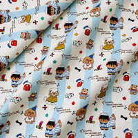 Cute Dog Print Striped Canvas Fabric By The Yard in light blue and white cotton, featuring a repeating pattern of cartoon dogs, bears, and the text, Fortunately, there are puppies and good weather.