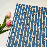 Cute Dog Print Striped Canvas Fabric By The Yard in blue and white with cartoon bears, featuring two pink tulips resting beside it.