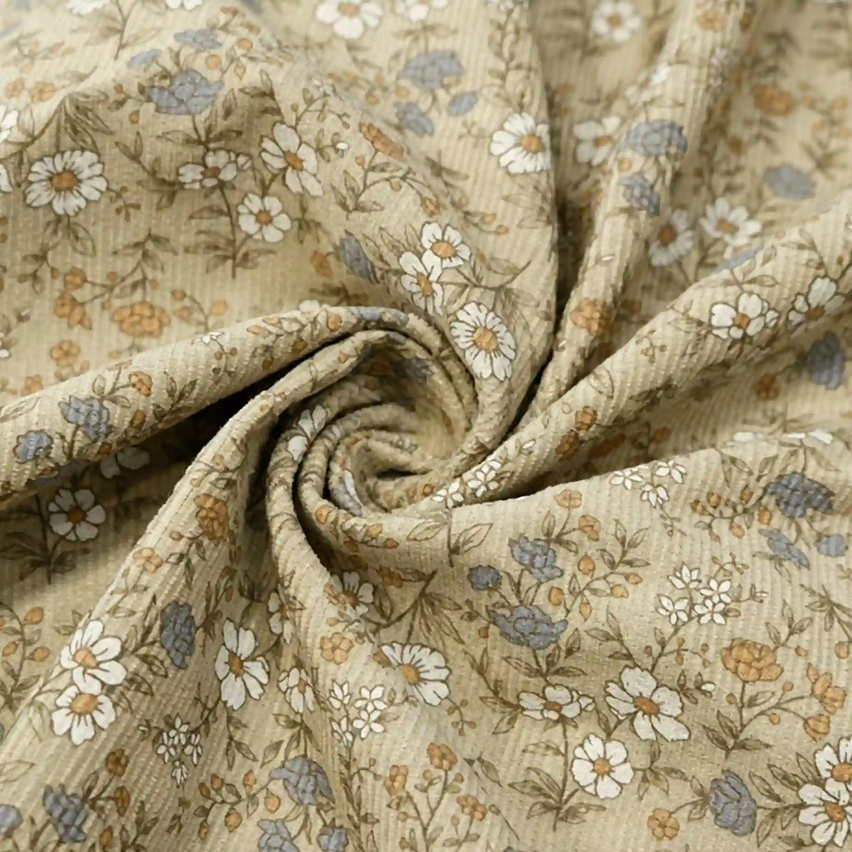 Longan Craft’s Daisy Print 16 Wale Corduroy Fabric by the yard is a fine wale, 100% cotton beige corduroy material featuring a delicate print of small white, blue, and yellow flowers—arranged here in a swirl shape to showcase its soft texture and charming floral design—perfect for fall DIY projects.
