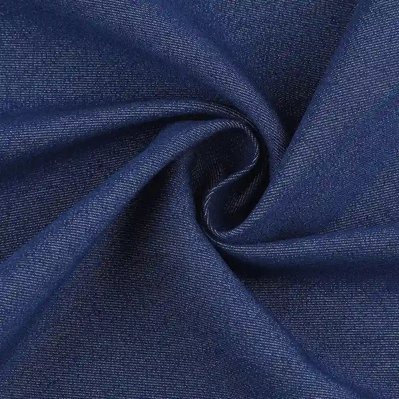 Close-up of Denim Color Twill Viscose Fabric by the yard from Longan Craft, featuring soft texture and subtle weave, twisted in a swirl to highlight its smooth surface—ideal stretch elastane viscose material for chic dressmaking.