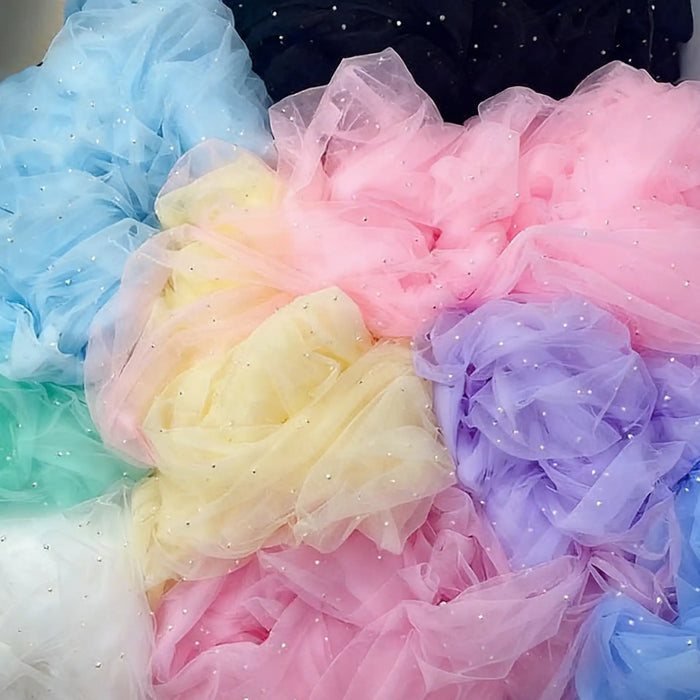 Longan Craft's Elegant Pearl Embellished Tulle Fabric By The Yard comes in solid pastel shades and black, adorned with tiny sparkly beads—perfect for bridal gowns or elegant evening dresses. Lightweight, sheer, and ideal for weddings.