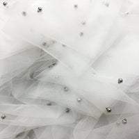 Close-up of Elegant Pearl Embellished Tulle Fabric by Longan Craft, featuring layers of solid color sheer tulle with pearls and shiny silver beads—ideal for bridal gowns or evening dress material. Available by the yard, lightweight and delicate.