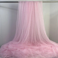 Longan Craft's Elegant Pearl Embellished Tulle Fabric By The Yard features sheer tulle with white pearls, draped beautifully—ideal for bridal gowns or elegant evening dresses. This lightweight, solid color fabric is perfect for wedding creations.
