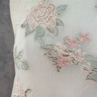 Close-up of Longan Craft's Embossed Rose Organza Fabric by the Yard—sheer, lightweight gold floral jacquard with elegant rose and leaf embroidery, perfect for vintage-inspired camisole tops.