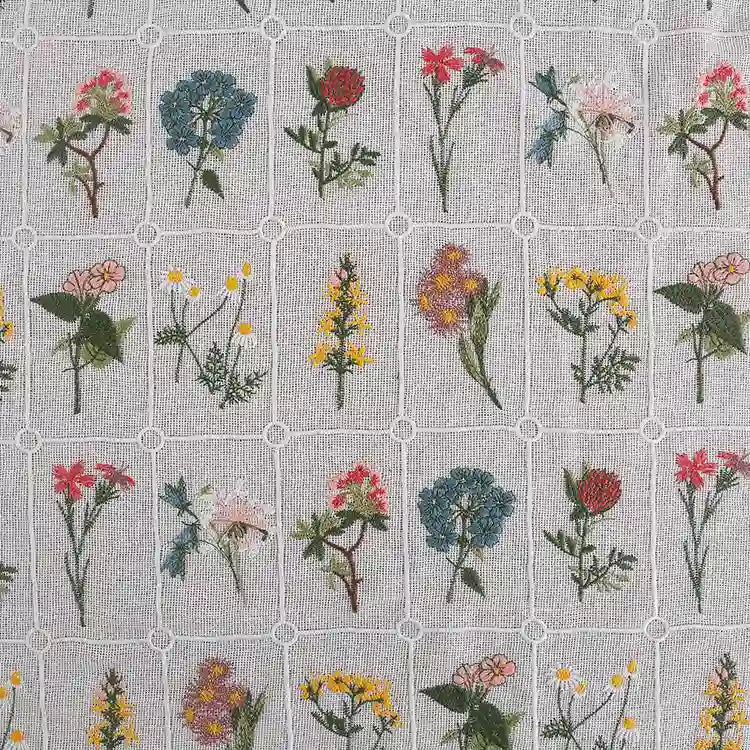 Longon Craft’s Plant Floral Embroidered Cotton Fabric By The Yard features colorful botanical embroidery in a grid pattern on soft cotton, perfect for apparel and crafts.