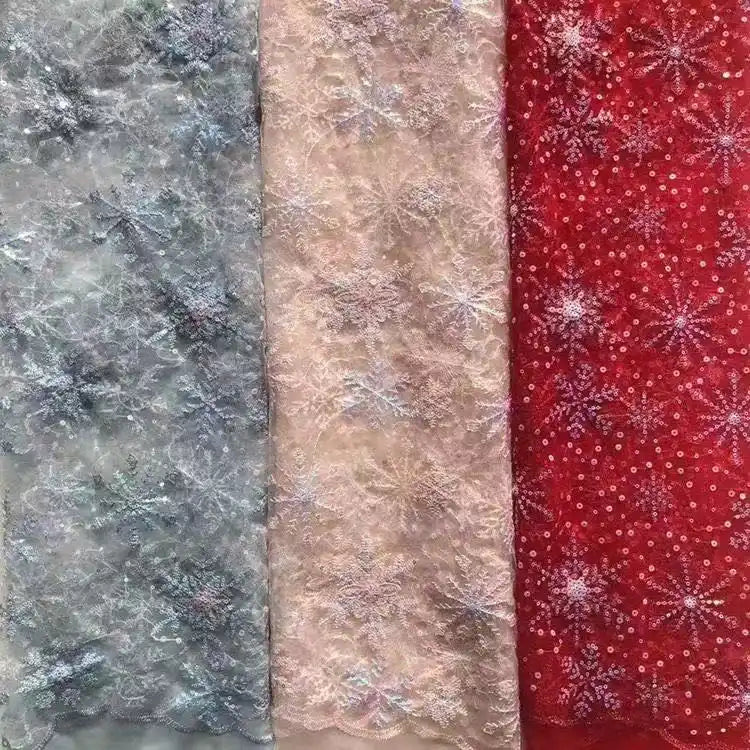 Longan Craft's Embroidered Sequin Tulle Fabric features delicate, shimmering snowflake embroidery in silver, light pink, and red—ideal for DIY wedding dresses and children’s apparel. Each yard has a translucent, elegant texture.