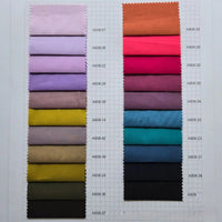 A chart of 20 Fine Cotton Lawn Fabric swatches by Longan Craft, shown as rectangles in two vertical columns on graph paper, each labeled with a unique code and featuring solid colors—ideal lightweight fabric for casual shirts.