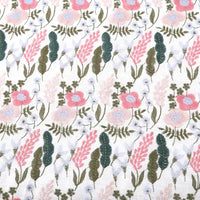 Longon Craft's Floral Cotton Linen Embroidered Fabric by the yard features pink, light blue, and white flower embroidery with green leaves on a white/black cotton linen background—ideal for dressmaking and crafts.