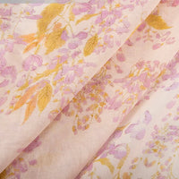Close-up of Longan Craft's Floral Digital Print Voile Fabric By The Yard—lightweight, breathable cotton with a delicate pastel floral pattern, gently folded. Ideal for tops and other airy garments.