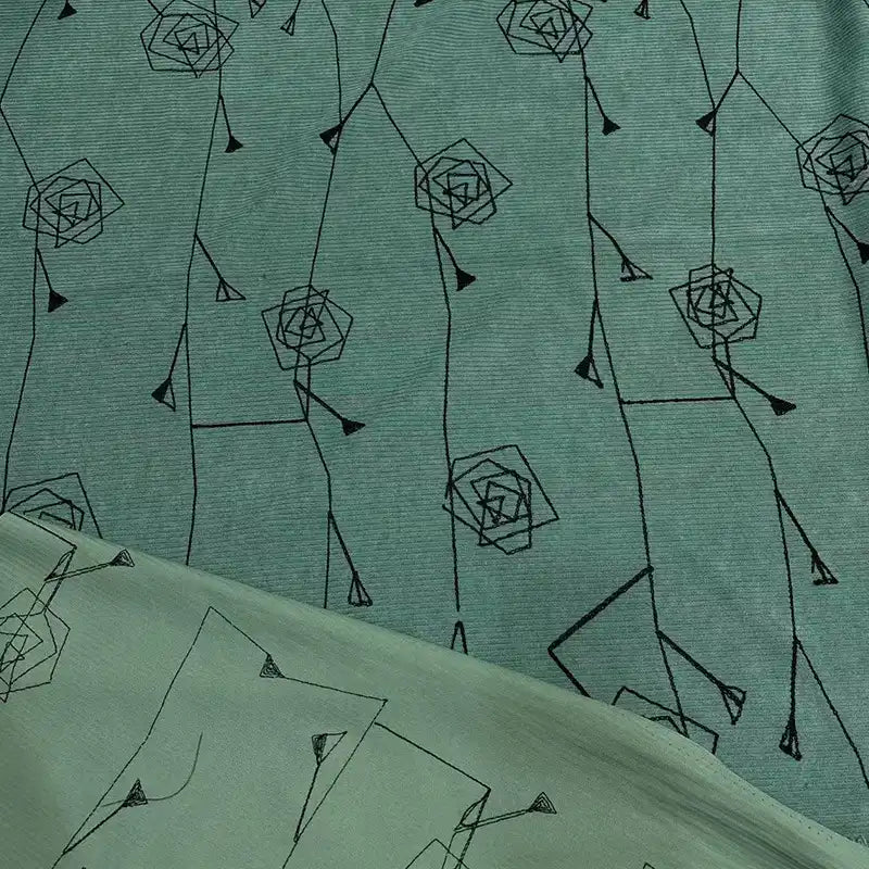 Longan Craft Floral Embroidered Polyester Corduroy Fabric by the Yard features fine wale texture and a black geometric rose pattern. The reverse side displays a lighter, subtler design—ideal DIY corduroy textile for pants and more.