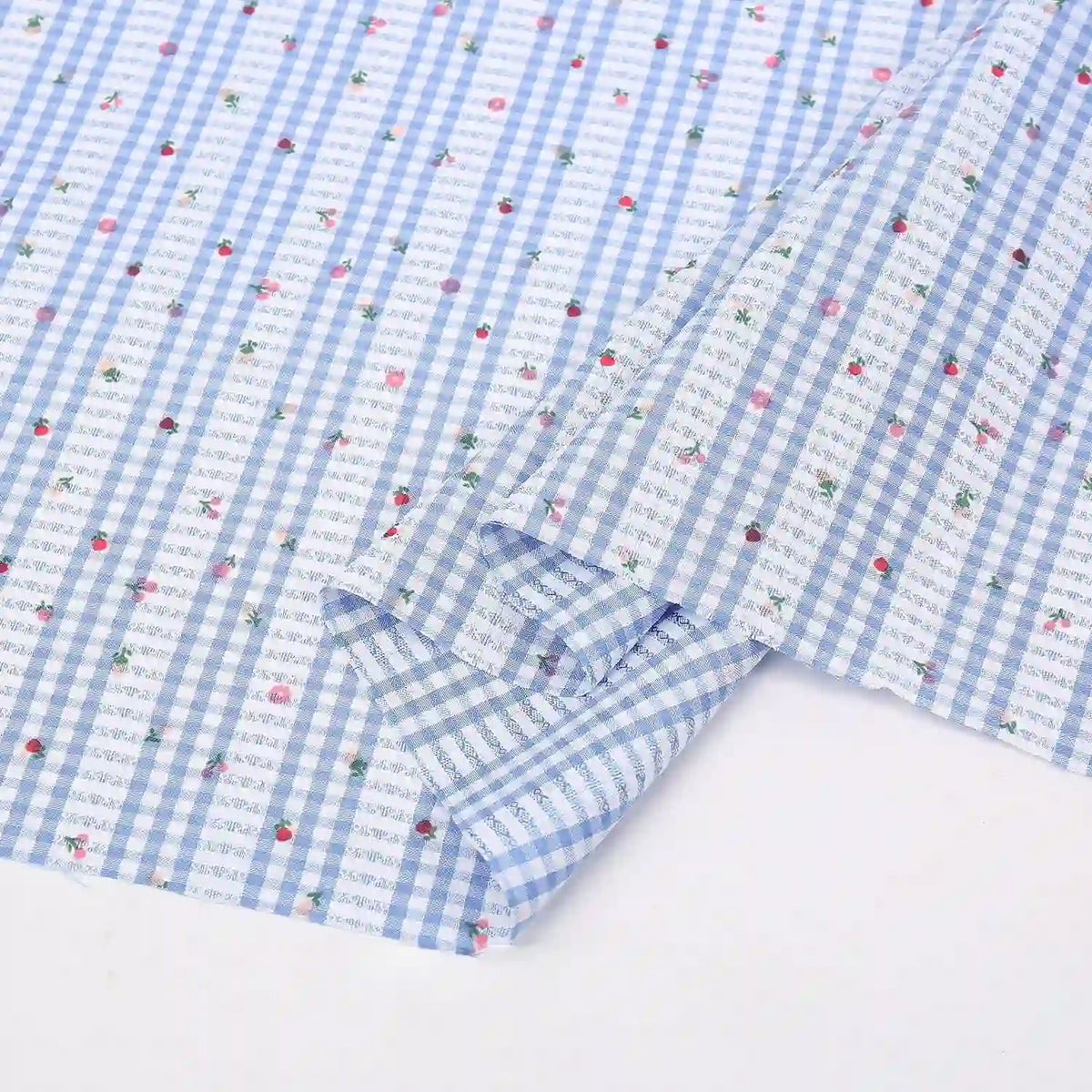 Longan Craft's Floral Gingham Quilting Fabric by the yard features a blue and white botanical polyester design, perfect for quilting projects or casual wear. Comfy material laid flat, ready to inspire your next creation!.