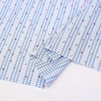 Longan Craft's Floral Gingham Quilting Fabric by the yard features a blue and white botanical polyester design, perfect for quilting projects or casual wear. Comfy material laid flat, ready to inspire your next creation!.