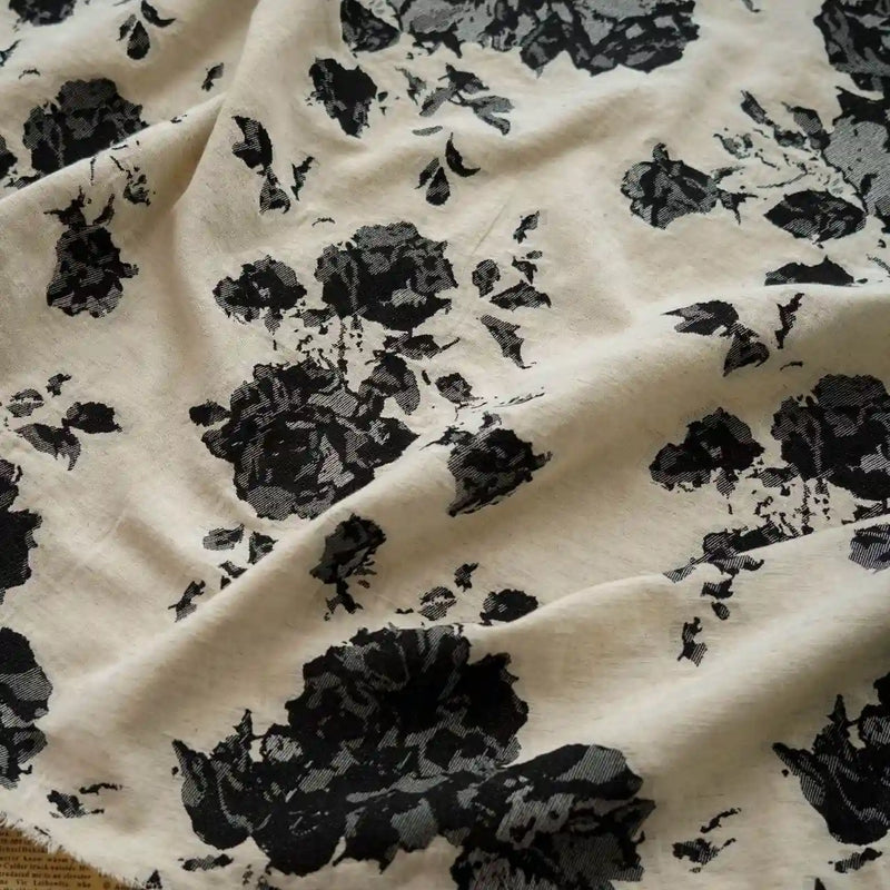 Floral Jacquard Cotton Linen Fabric by Longan Craft features multicolor botanical flower prints on a cream cotton-linen blend. Sold by the yard, this DIY dressmaking material drapes elegantly with casually wrinkled texture and varied floral patterns.