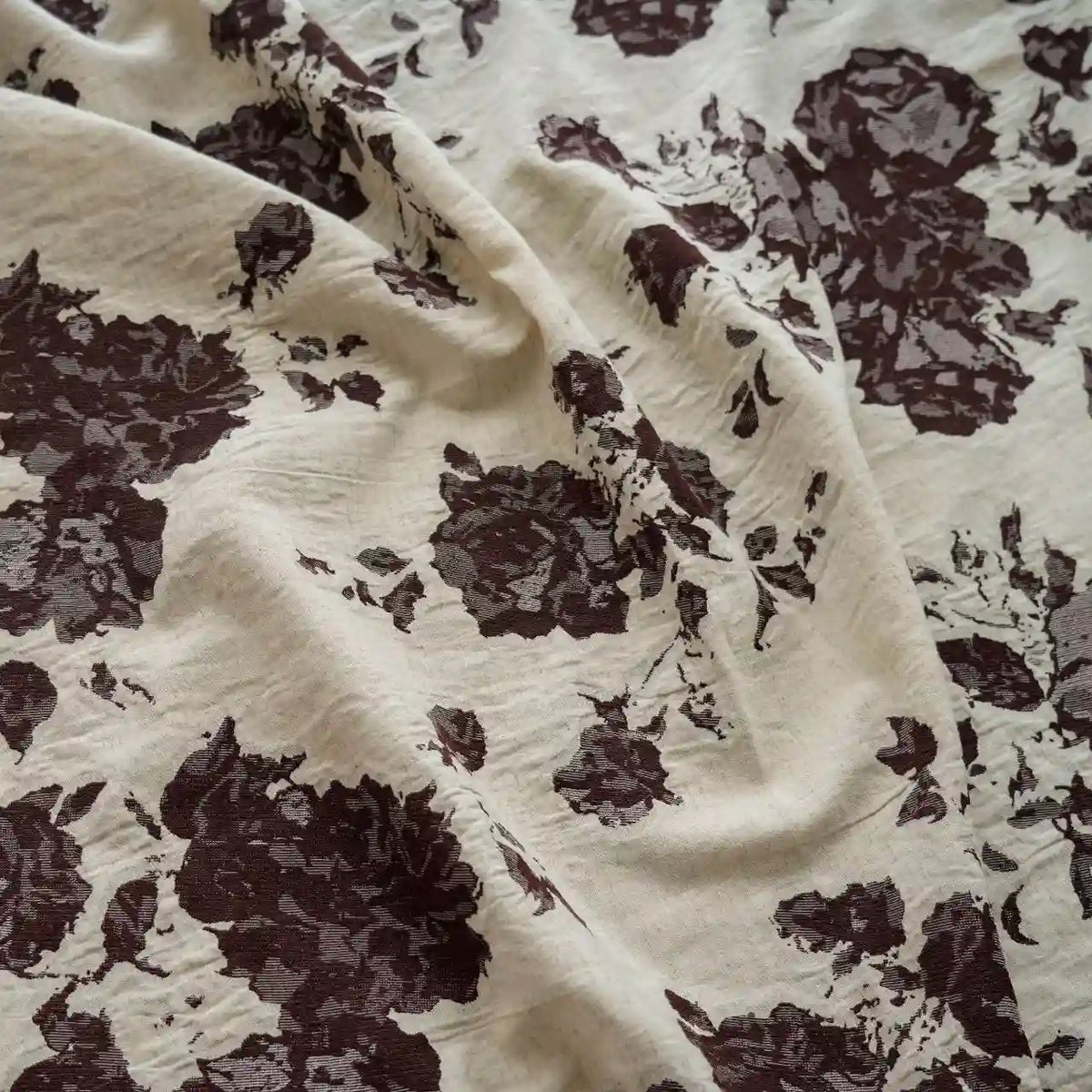 A close-up of Longan Craft’s Floral Jacquard Cotton Linen Fabric by the yard, featuring a multicolor botanical flower print and a textured finish—ideal DIY material for dressmaking and creative projects.