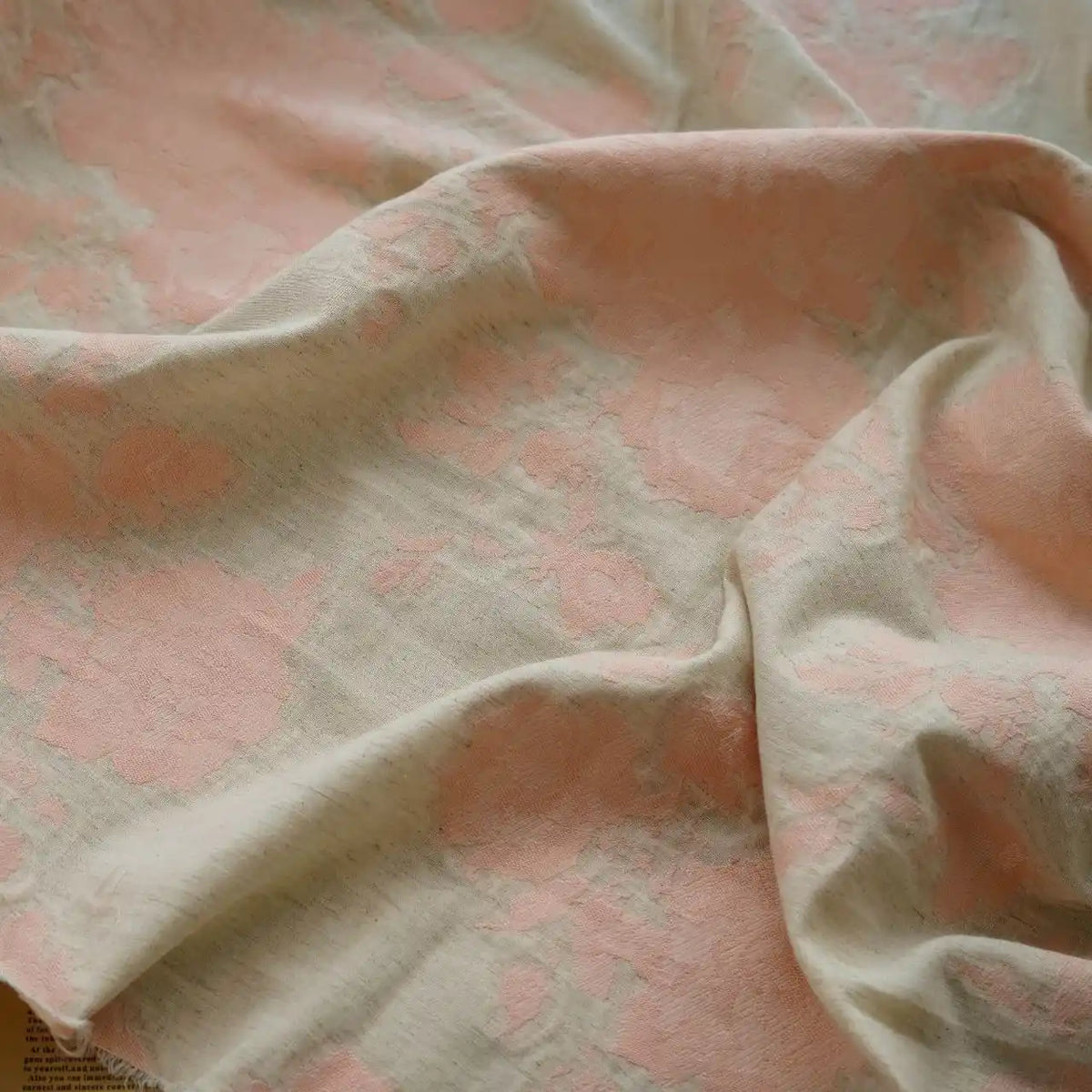 A close-up of Longan Craft's Floral Jacquard Cotton Linen Fabric by the yard, showcasing a soft, textured beige base with multicolor botanical floral patterns—ideal DIY material for dressmaking.