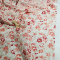 Longan Craft’s Floral Prin Chiffon Silk Fabric By The Yard features a soft, lightweight cotton silk blend with a pink and red floral print, perfect for sheer curtains or elegant projects. Includes two wooden spools shown atop the airy material.