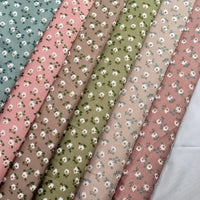 Longan Craft's Floral Printed Peachskin Fabric by the Yard features soft microfiber polyester in blue, pink, brown, green, and beige shades with small white flowers—perfect for comfy apparel projects.