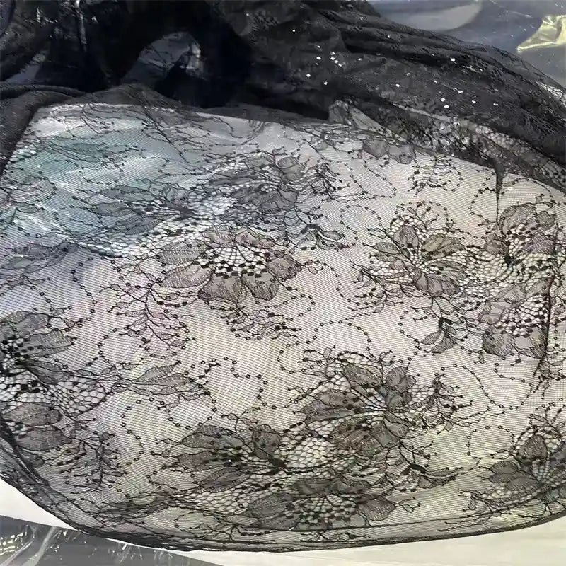 A close-up of Longan Craft’s Floral Sequin Lace Fabric By The Yard—a colorful, sparkling lace material with intricate floral and vine patterns, ideal for dresses, bridal wear, or elegant evening gowns.