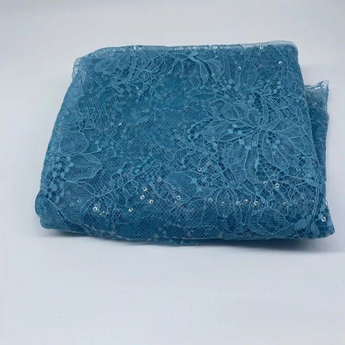 A folded piece of Floral Sequin Lace Fabric By The Yard from Longan Craft, featuring a colorful sparkling floral pattern with sequins, perfect for dresses, shown on a plain white background.