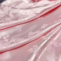Longan Craft’s Floral Polyester Satin Fabric By The Yard features a colorful satin jacquard design and glossy, elegant texture—perfect for dresses and special projects.