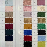 A sample chart shows 36 numbered swatches of Longan Craft’s Floral Polyester Satin Fabric By The Yard, featuring colorful satin jacquard material in shades like blue, red, green, beige, and elegant floral patterns for dresses.