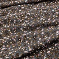 Close-up of Longan Craft Floral and Animal Printed 100% Cotton Jersey Fabric by the yard, showing soft folds, textured surface, and muted pink, white, and brown floral prints—ideal jersey material for dresses.