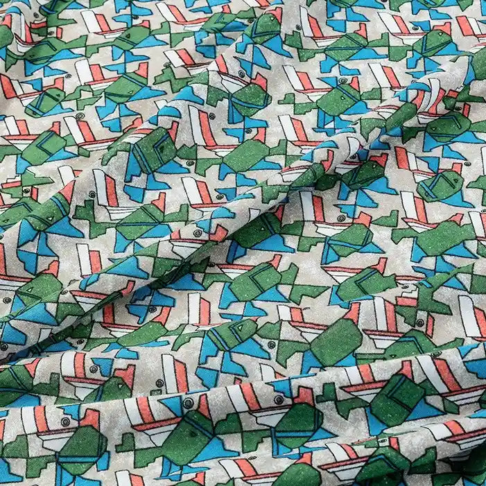 The Floral and Animal Printed Jersey Fabric by Longan Craft is a 100% cotton jersey fabric featuring colorful green watering cans, blue fish, and red-lined shapes on white—perfect for lively dresses and other clothing projects.