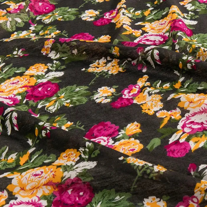 The Longan Craft Floral and Animal Printed Jersey Fabric By The Yard is a 100% cotton jersey, ideal for dresses. It features a black base with floral and animal prints, offering a soft drape and stylish texture for creative sewing projects.