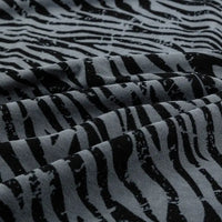 Close-up of Longan Craft 100% cotton jersey fabric by the yard, featuring a floral and animal print with soft folds and a breathable, slightly textured surface—ideal jersey material for dresses.