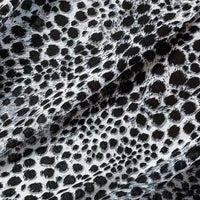 A close-up of Longan Craft’s Floral and Animal Printed 100% Cotton Jersey Fabric, highlighting its smooth texture and natural charm—ideal jersey material for dresses, sold by the yard.