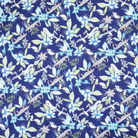 Longan Craft’s Floral Animal Printed Microfiber Peachskin Fabric by the yard features whimsical blue and white flowers, green leaves, and birds on a dark blue background with a watercolor look—ideal for dresses. Multicolor polyester, soft peachskin texture.
