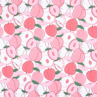 A playful, vibrant design of pink peaches and slices with green leaves on white, perfect for dresses using Longan Craft's Floral Animal Printed Microfiber Peachskin Fabric By The Yard—multicolor polyester with a peachskin texture.