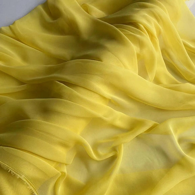 Longan Craft’s Georgette Silk Fabric By The Yard, made from 8 Momme pure mulberry silk crepe, drapes in soft, wavy folds for a light, airy texture with gentle shadows and highlights—perfect for elegant silk drapery projects.
