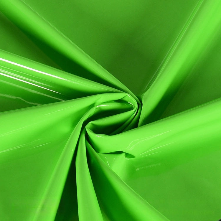 A close-up of Longan Craft's Glossy Stretch Vinyl Fabric By The Yard shows its shiny, smooth PU material in bright green, twisted at the center for dynamic folds—perfect for making jackets.