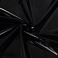 A close-up of Longan Craft's Glossy Stretch Vinyl Fabric by the yard, showing shiny PU material with reflective folds and dynamic lines—ideal for making jackets.