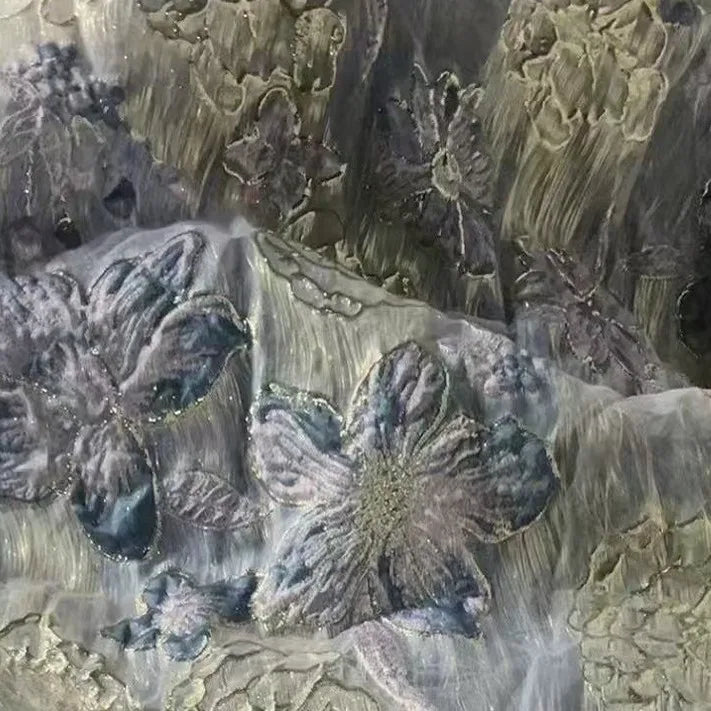 Close-up of Longan Craft's Golden Floral Jacquard Organza Fabric, featuring metallic and pastel patterns with layered purple flower motifs. This delicate organza material is perfect for dressmaking by the yard.